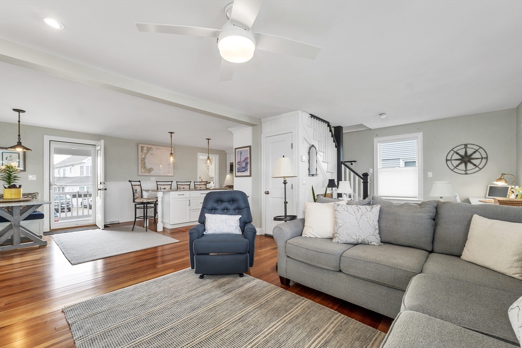 713 Ocean Boulevard Hampton, NH 03842 - Photo 16 of 42 a living room with furniture and kitchen view
