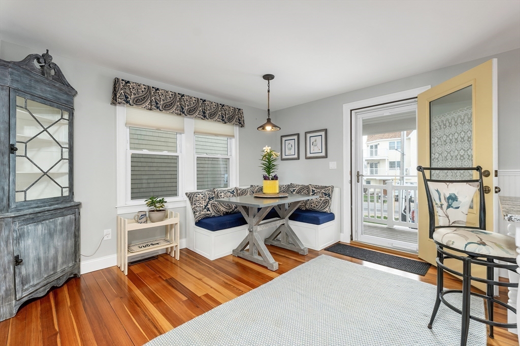 713 Ocean Boulevard Hampton, NH 03842 - Photo 17 of 42 a living room with furniture a window and a table