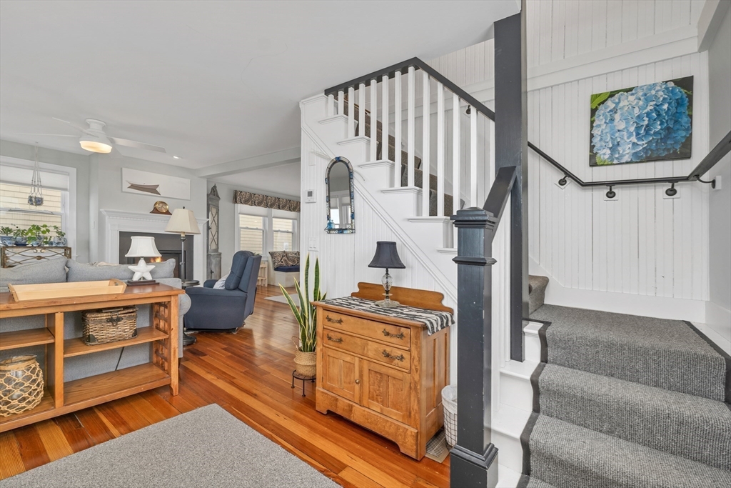 713 Ocean Boulevard Hampton, NH 03842 - Photo 23 of 42 a living room with furniture windows and a wooden floor