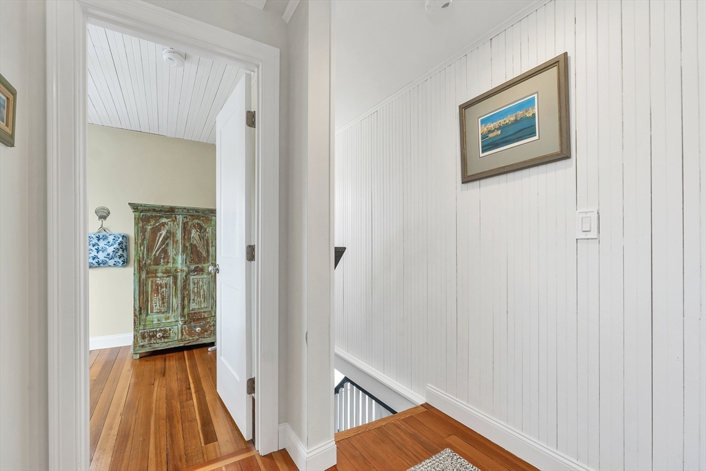 713 Ocean Boulevard Hampton, NH 03842 - Photo 27 of 42 a view of a hallway with wooden floor and entryway