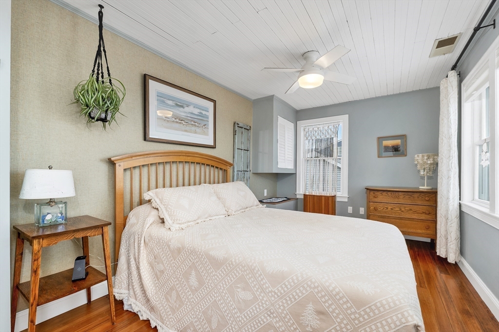 713 Ocean Boulevard Hampton, NH 03842 - Photo 32 of 42 a bedroom with furniture and a window
