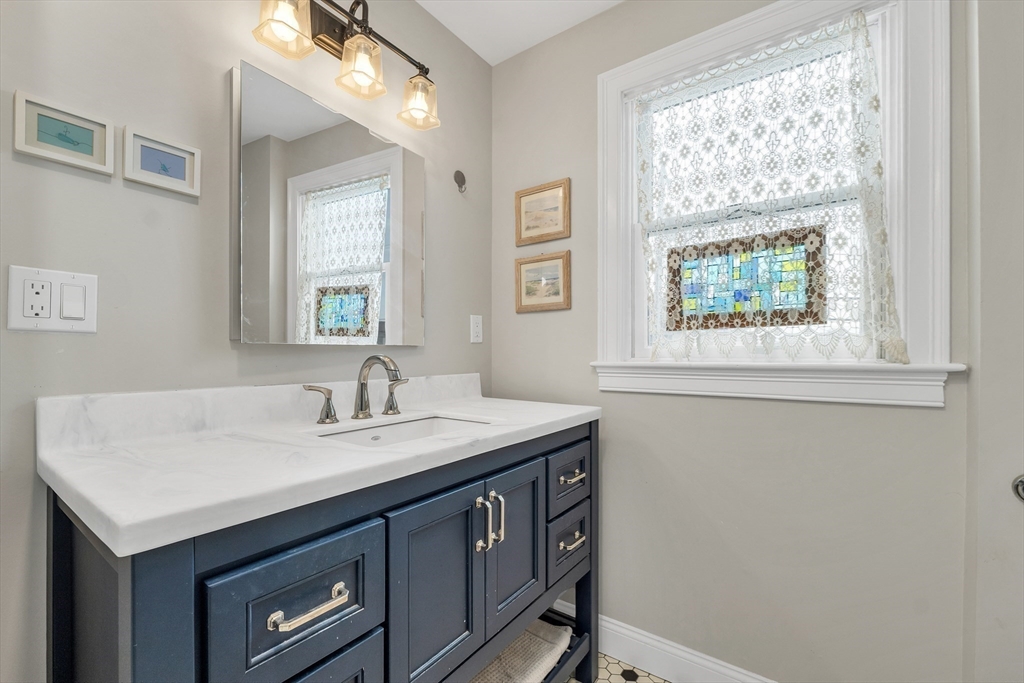 713 Ocean Boulevard Hampton, NH 03842 - Photo 34 of 42 a utility room with a sink cabinets and a window
