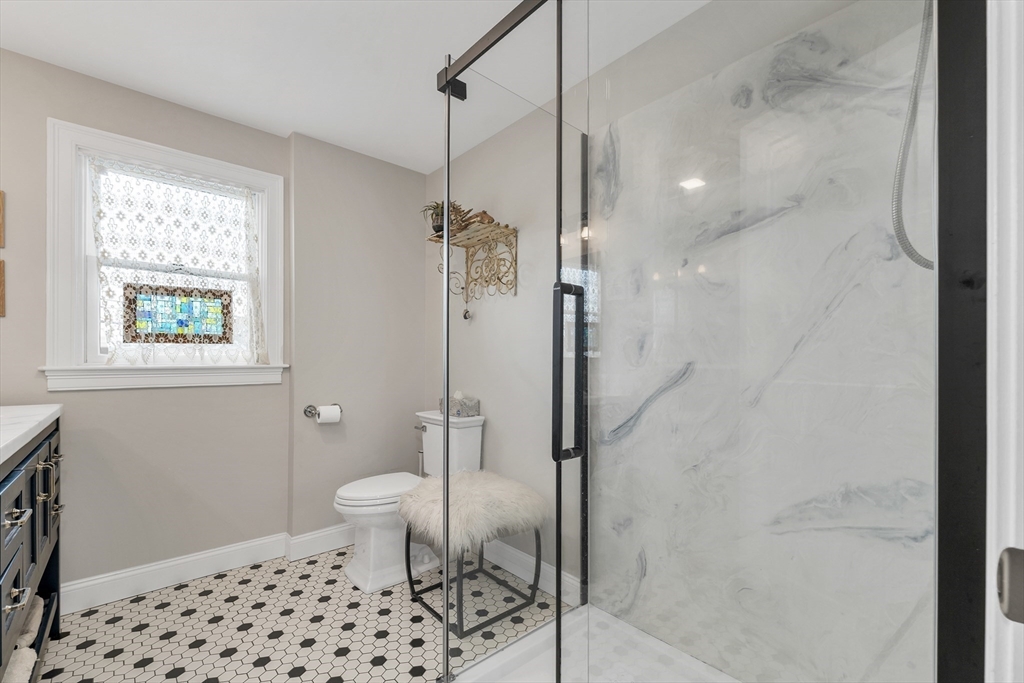 713 Ocean Boulevard Hampton, NH 03842 - Photo 35 of 42 a bathroom with a toilet and a shower