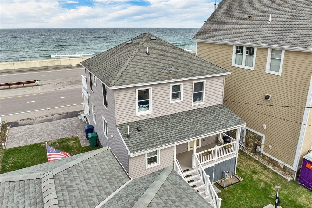 713 Ocean Boulevard Hampton, NH 03842 - Photo 40 of 42 a front view of a house with a yard