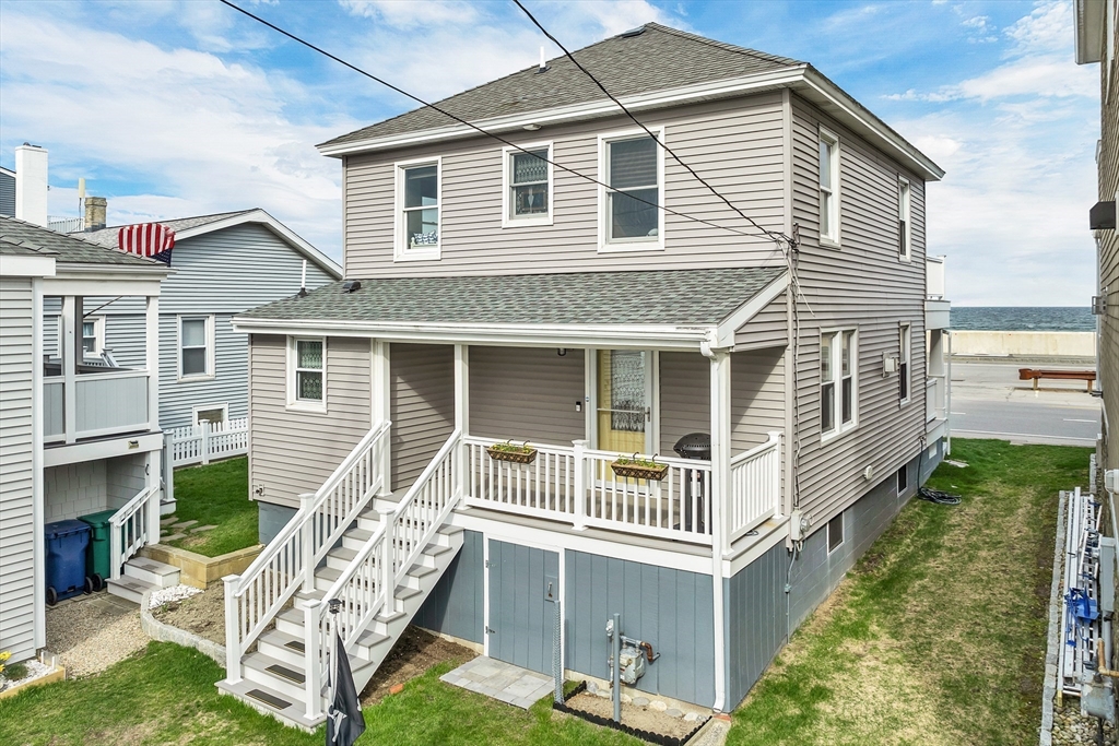 713 Ocean Boulevard Hampton, NH 03842 - Photo 4 of 42 a front view of a house with a yard and porch