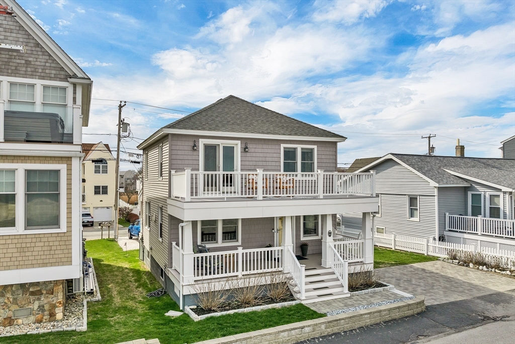 713 Ocean Boulevard Hampton, NH 03842 - Photo 7 of 42 a front view of a house with a yard