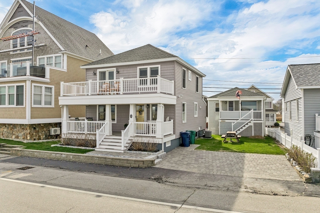 713 Ocean Boulevard Hampton, NH 03842 - Photo 8 of 42 a front view of a house with a yard