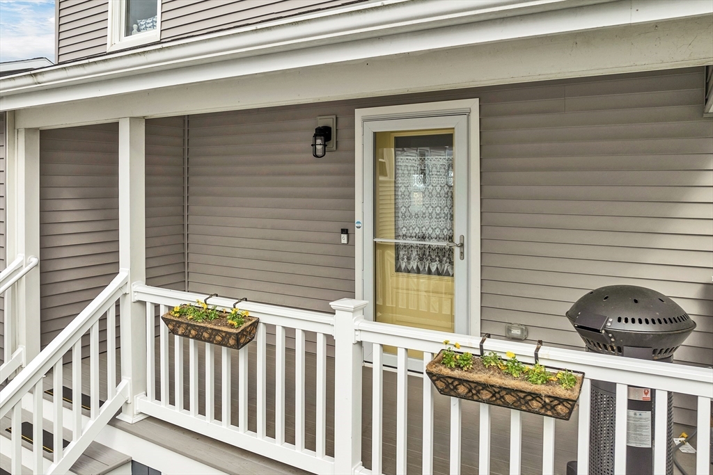 713 Ocean Boulevard Hampton, NH 03842 - Photo 9 of 42 a view of a chair and a gate
