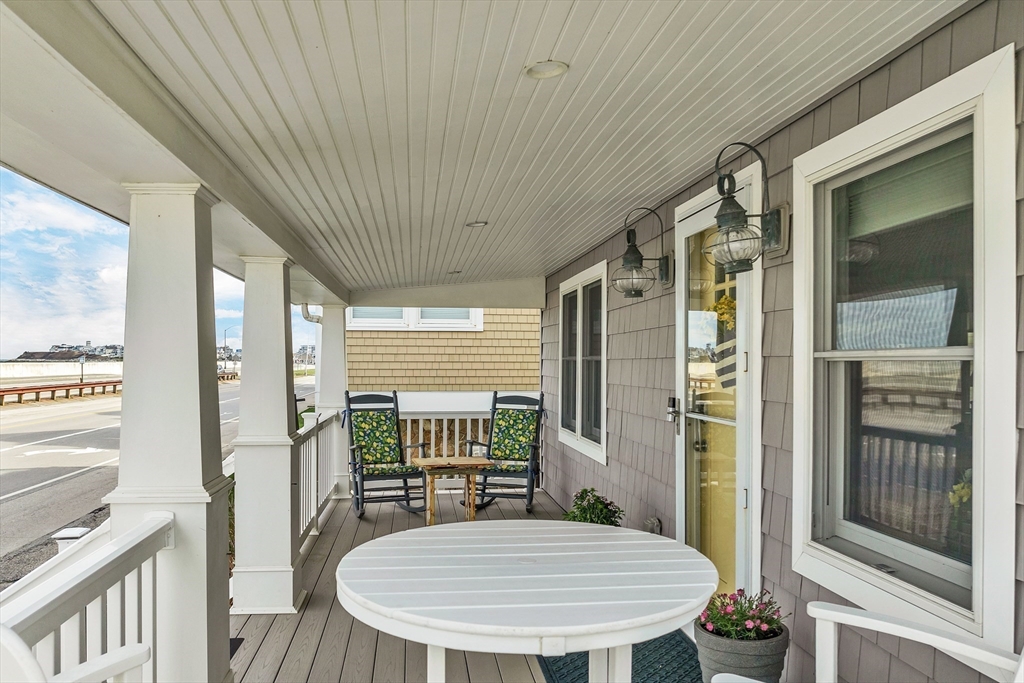 713 Ocean Boulevard Hampton, NH 03842 - Photo 10 of 42 a dining room with furniture and wooden floor