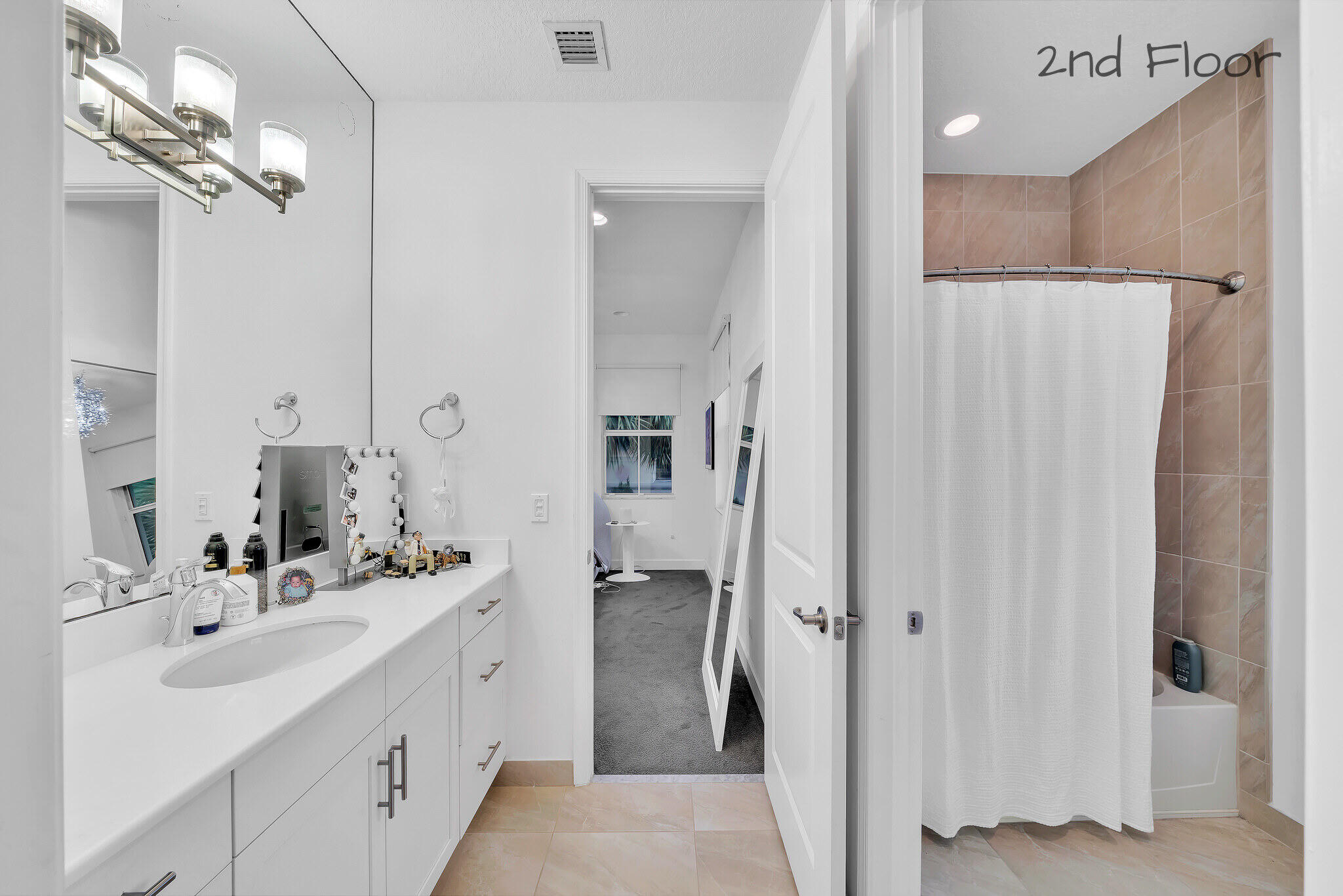 23008 Clear Echo Drive, Unit 11 Boca Raton, FL 33433 - Photo 13 of 64 a bathroom with a double vanity sink mirror and shower