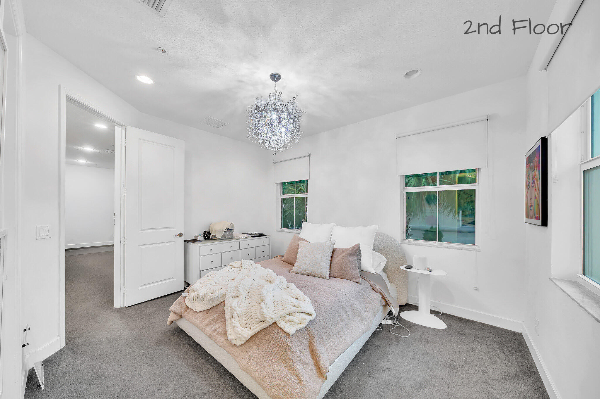 23008 Clear Echo Drive, Unit 11 Boca Raton, FL 33433 - Photo 14 of 64 a spacious bedroom with a bed and a window