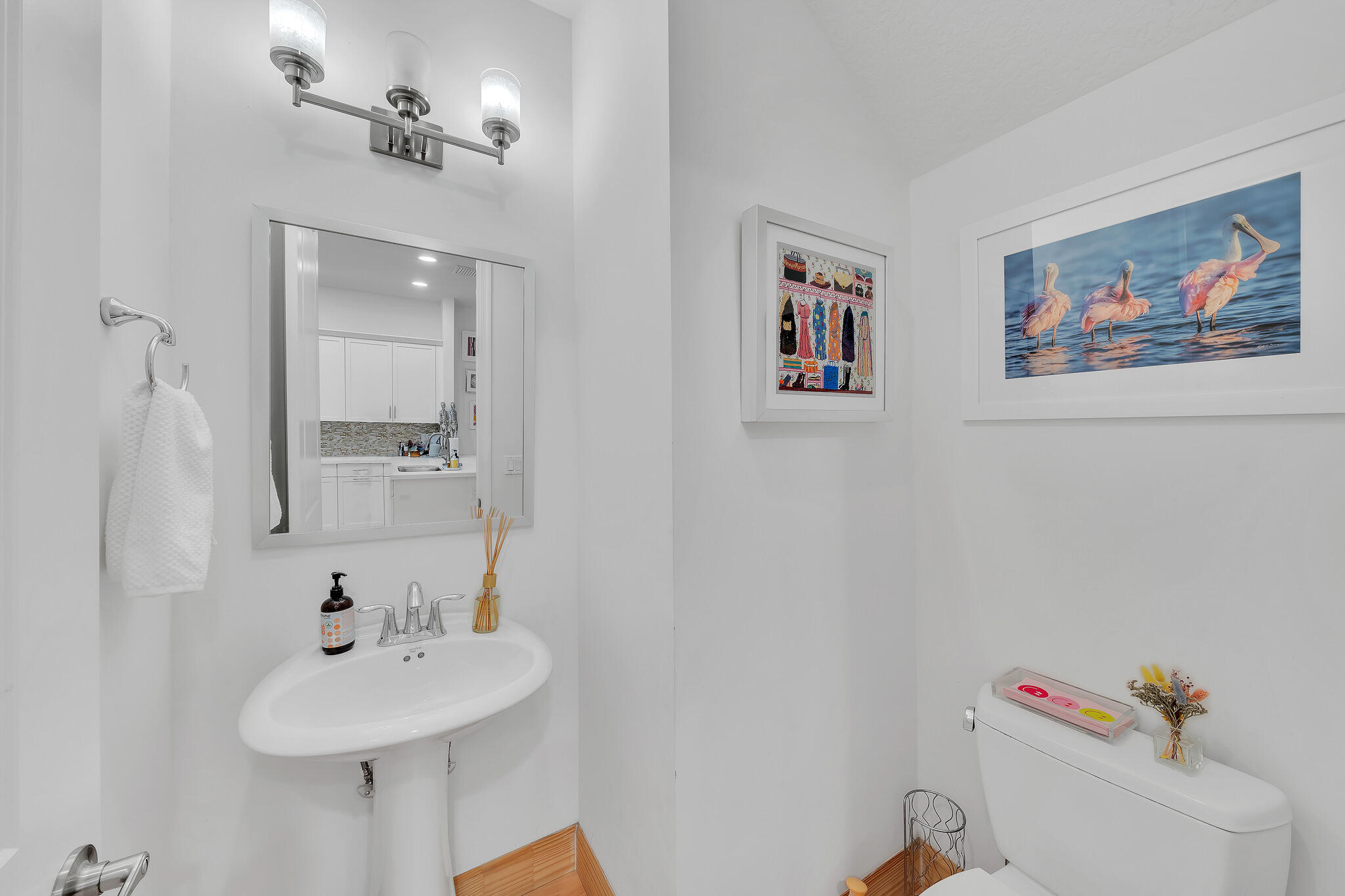23008 Clear Echo Drive, Unit 11 Boca Raton, FL 33433 - Photo 25 of 64 a bathroom with a sink and a mirror