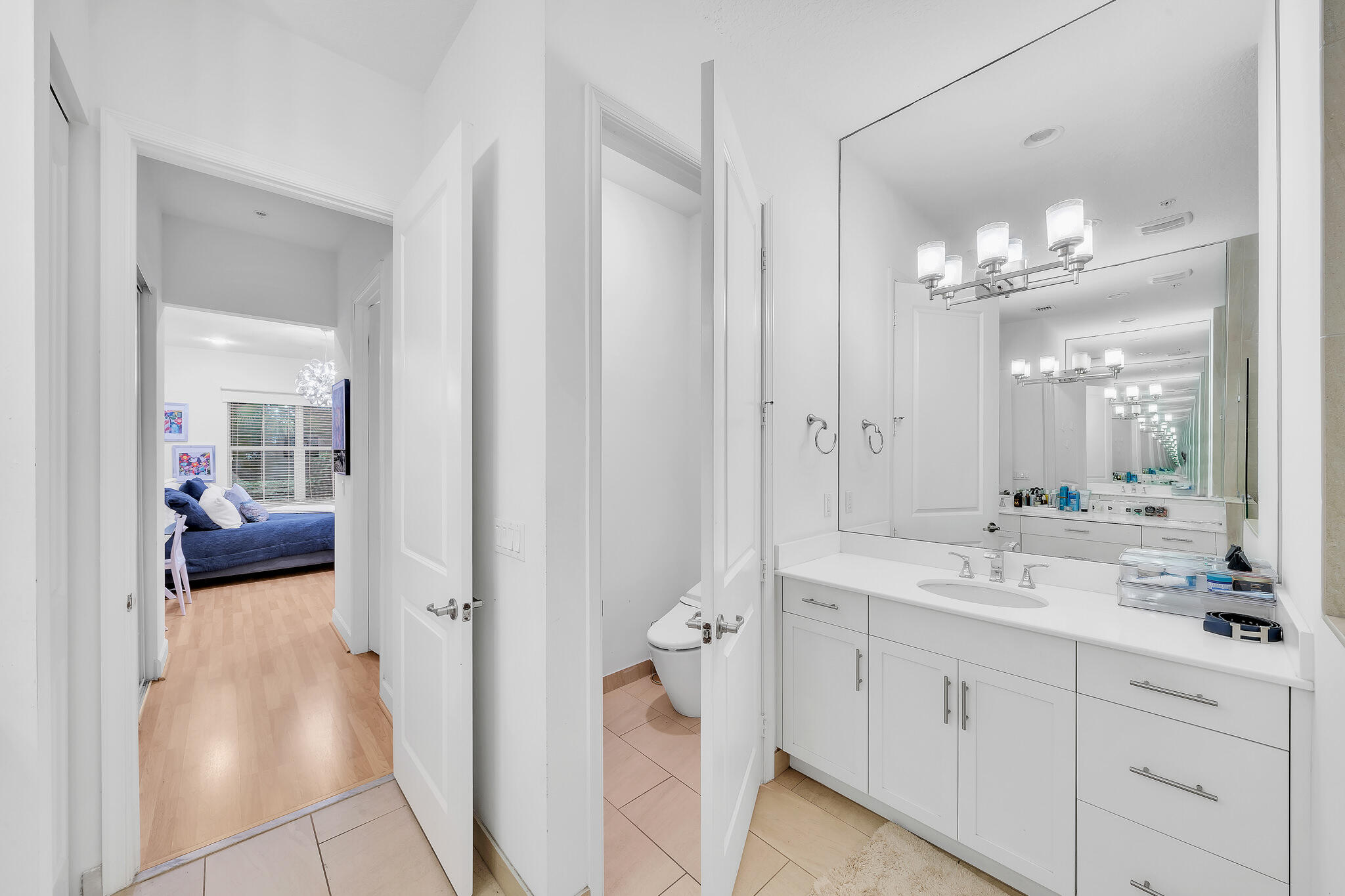 23008 Clear Echo Drive, Unit 11 Boca Raton, FL 33433 - Photo 35 of 64 a en suite bathroom with a double sink and mirror