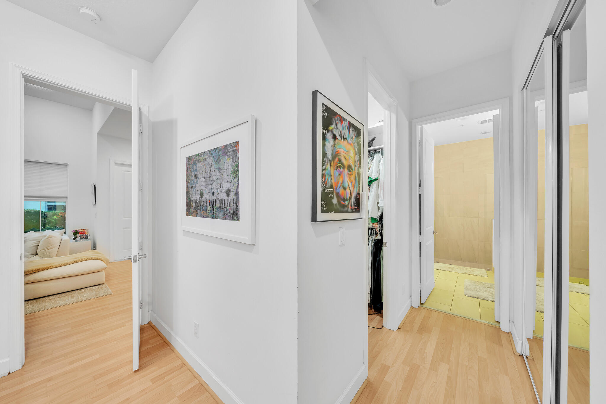 23008 Clear Echo Drive, Unit 11 Boca Raton, FL 33433 - Photo 37 of 64 a view of a hallway with wooden floor and furniture