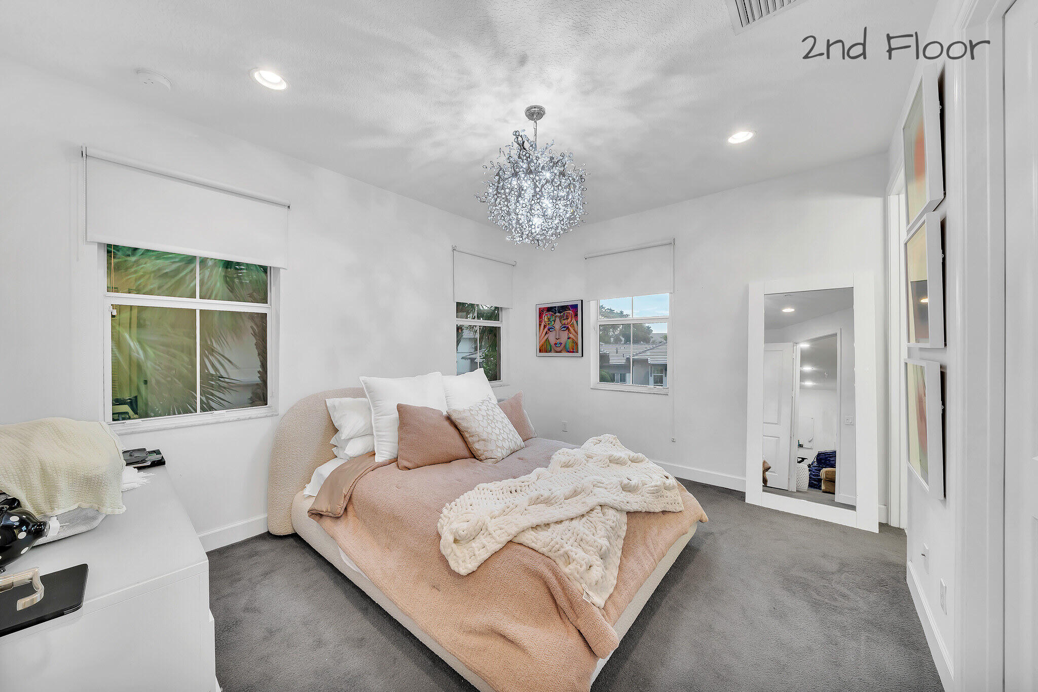 23008 Clear Echo Drive, Unit 11 Boca Raton, FL 33433 - Photo 44 of 64 a bedroom with a large bed and a window