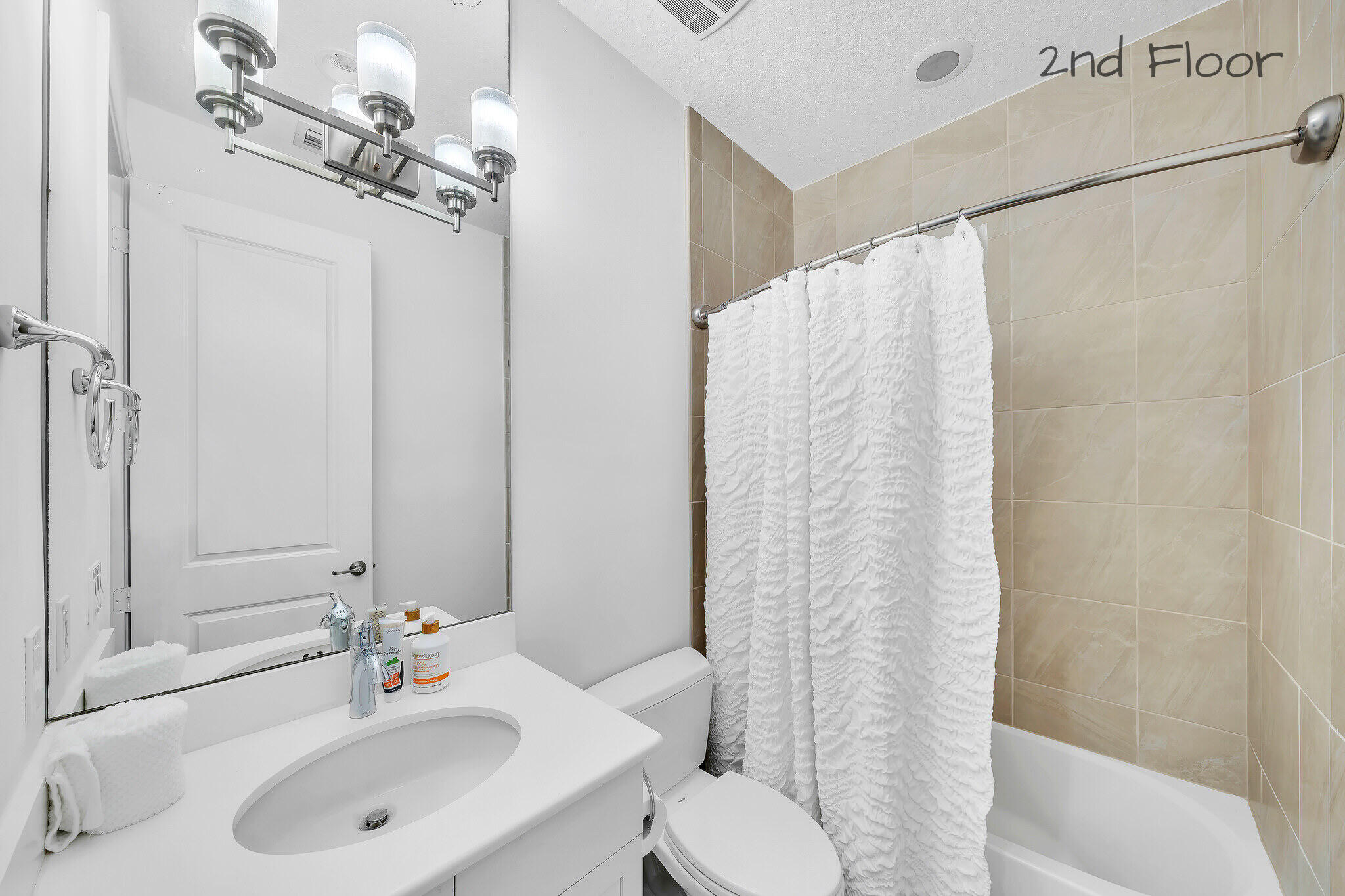 23008 Clear Echo Drive, Unit 11 Boca Raton, FL 33433 - Photo 46 of 64 a bathroom with a sink toilet and shower