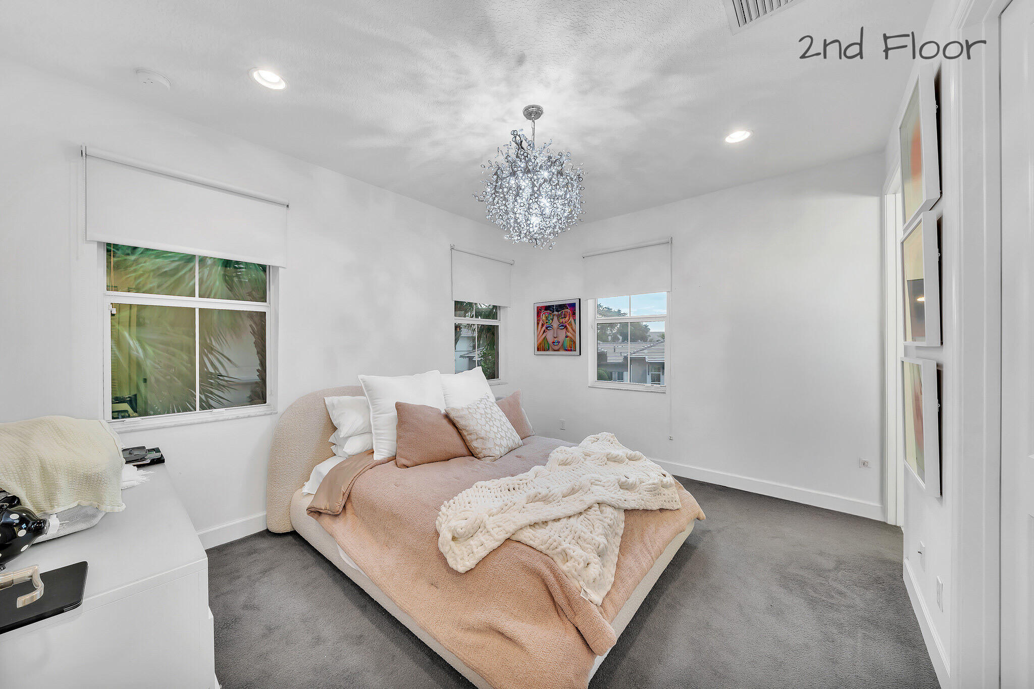 23008 Clear Echo Drive, Unit 11 Boca Raton, FL 33433 - Photo 56 of 64 a bedroom with a large bed and a window