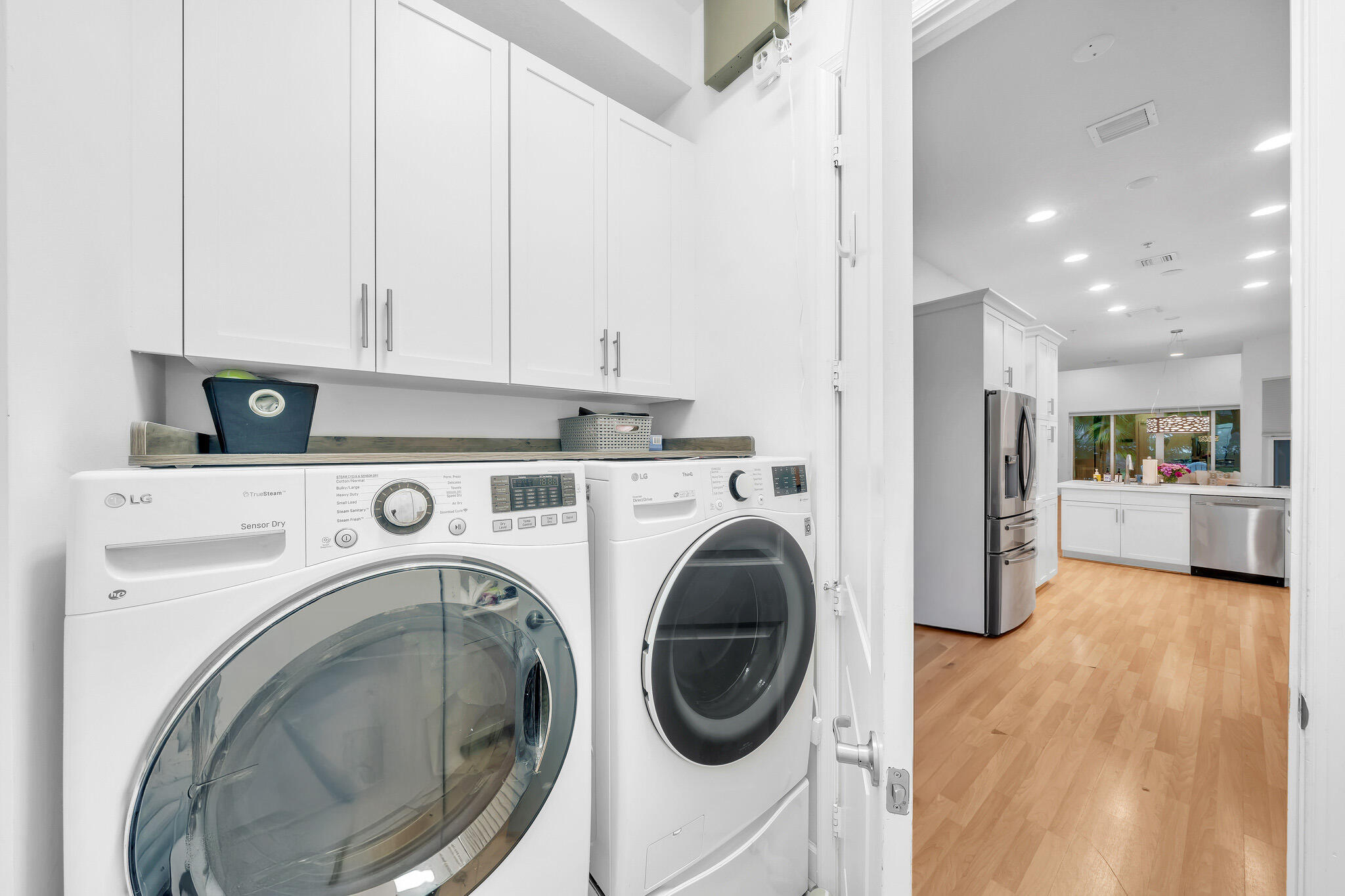 23008 Clear Echo Drive, Unit 11 Boca Raton, FL 33433 - Photo 6 of 64 a view of a kitchen with washer and dryer
