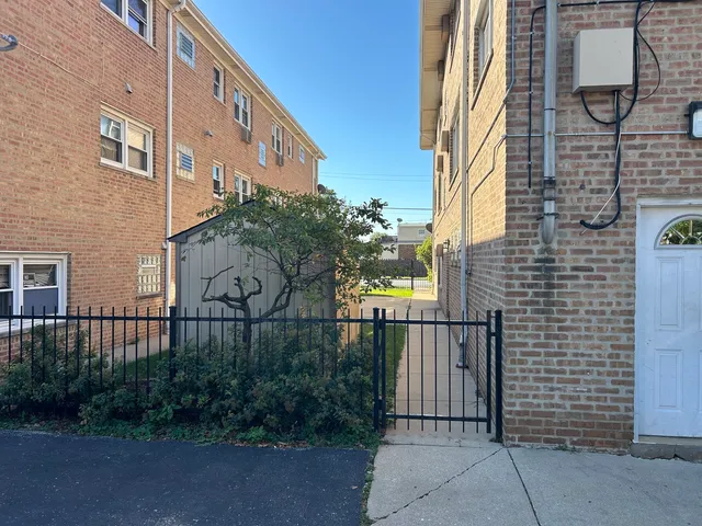 a brick building with a street sign on the side of it