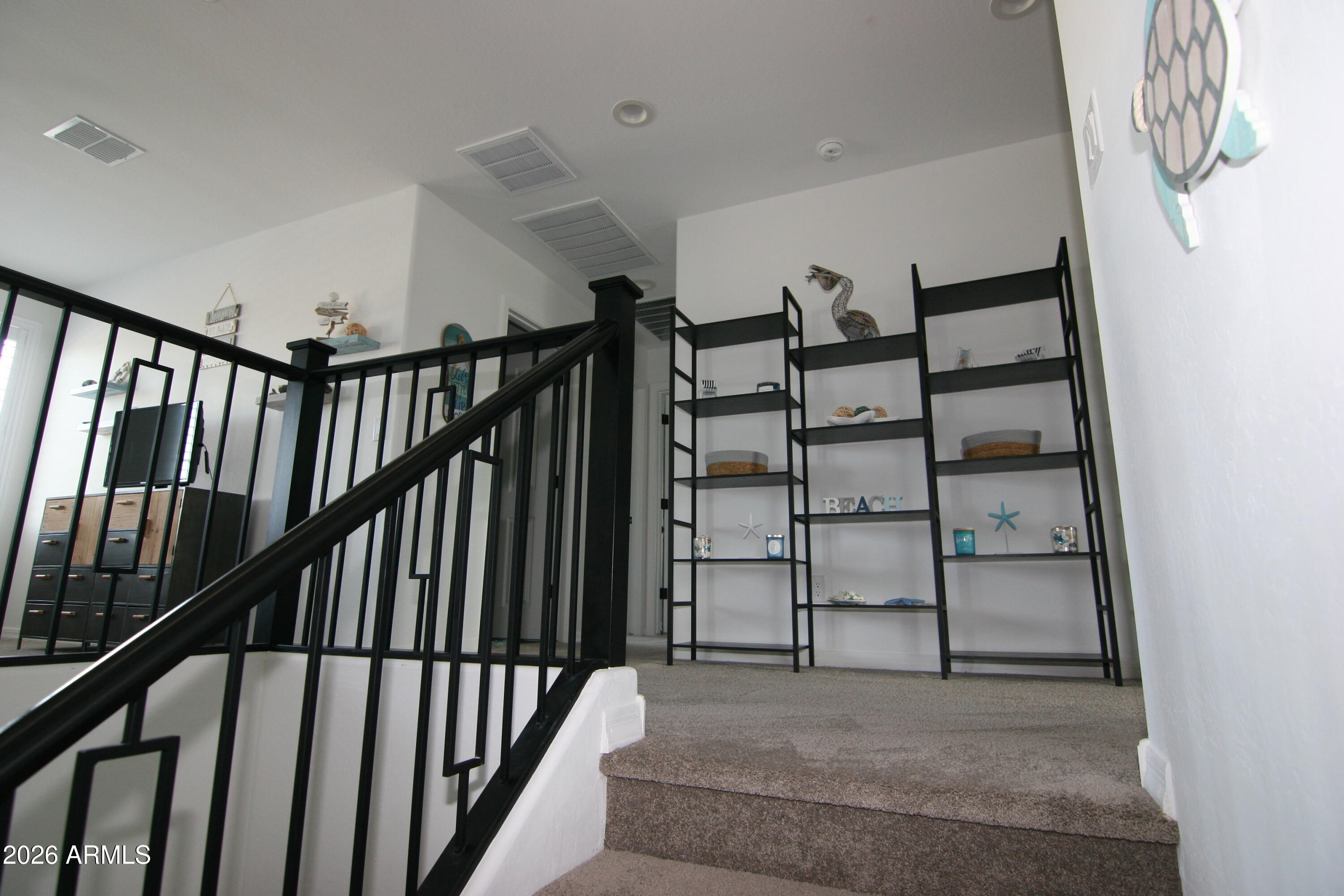 18487 West Ipswitch Way Surprise, AZ 85374 - Photo 9 of 36 a view of staircase with white walls and white walls