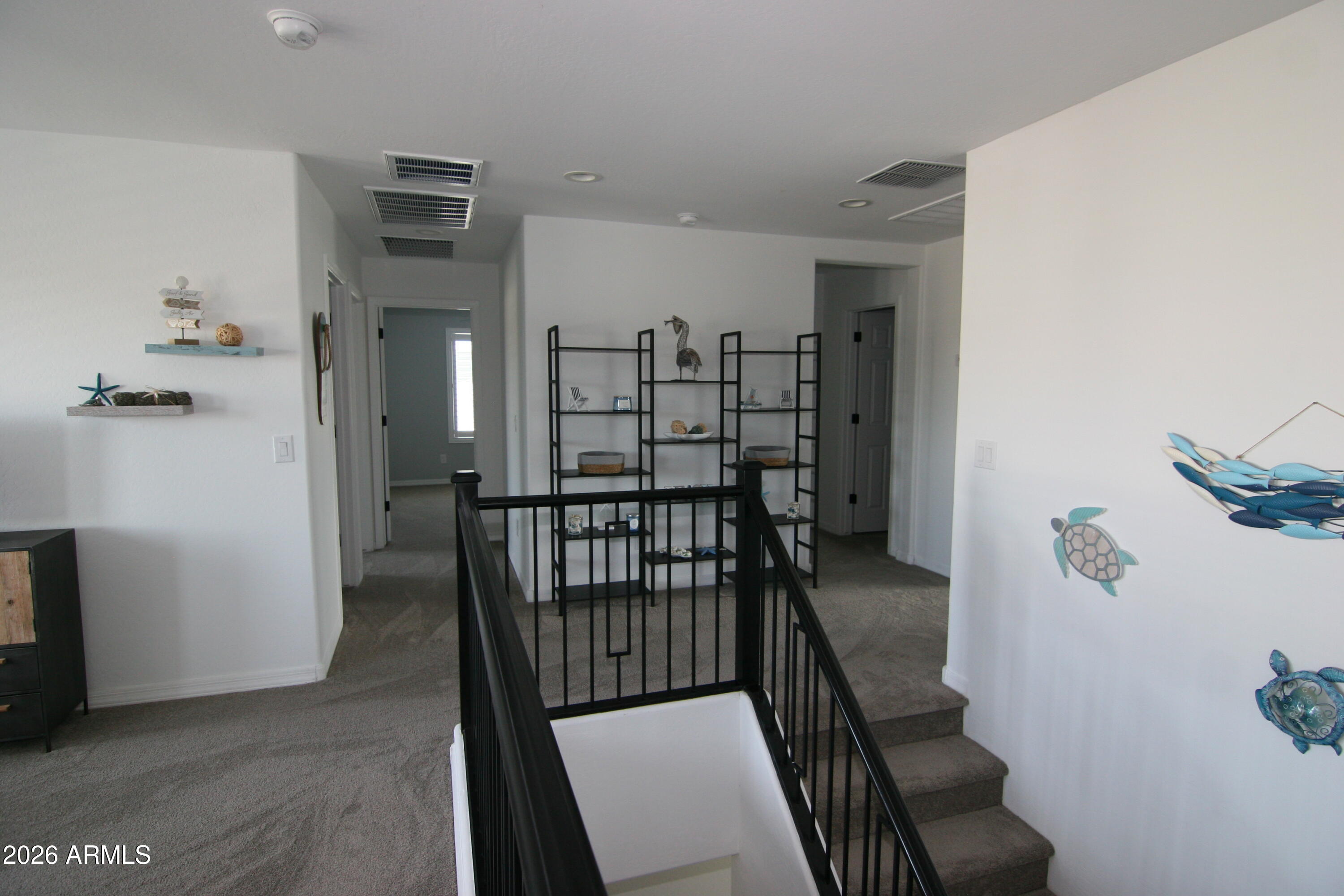 18487 West Ipswitch Way Surprise, AZ 85374 - Photo 10 of 36 a view of a hallway with seating area