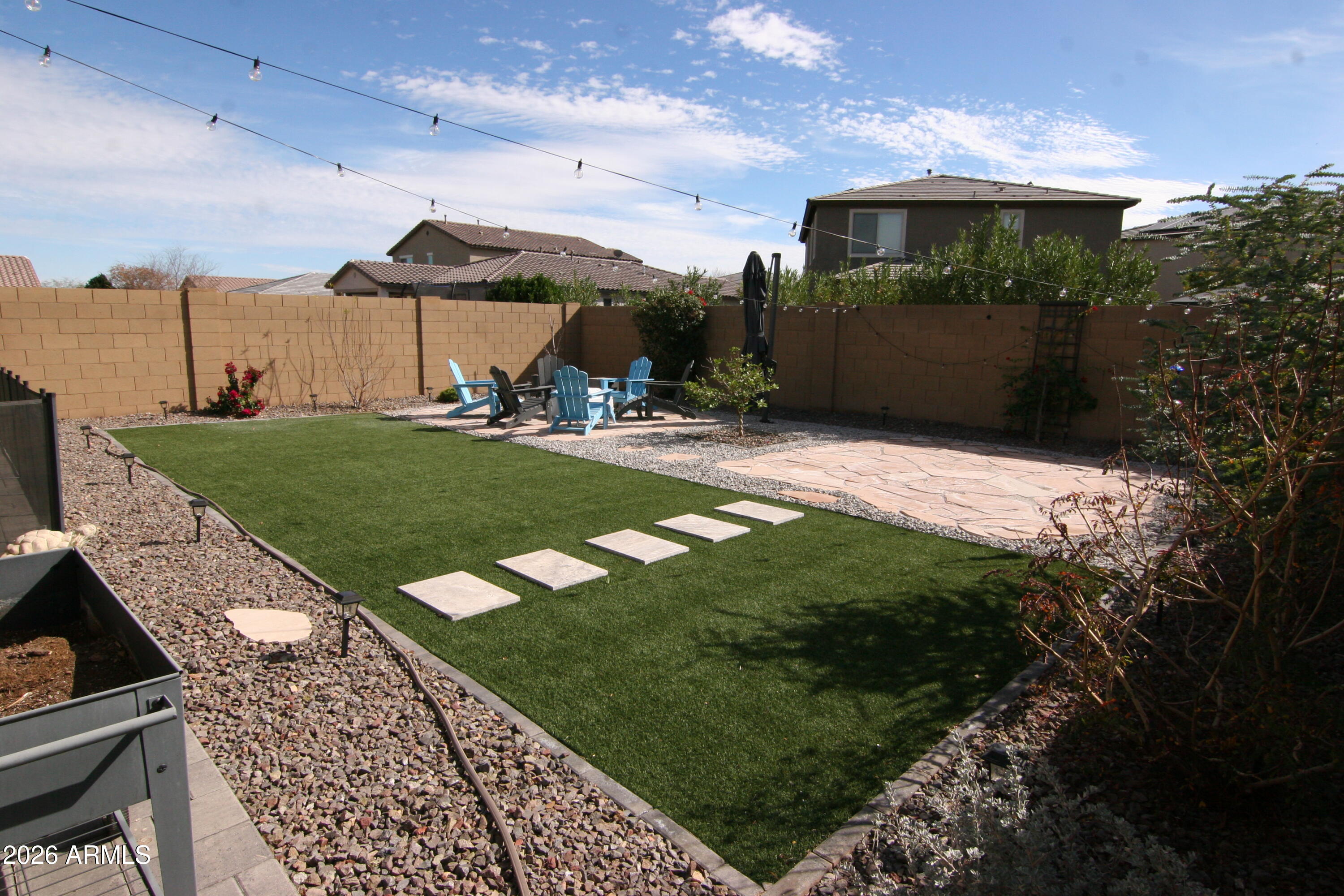 18487 West Ipswitch Way Surprise, AZ 85374 - Photo 24 of 36 a front view of a house with a yard
