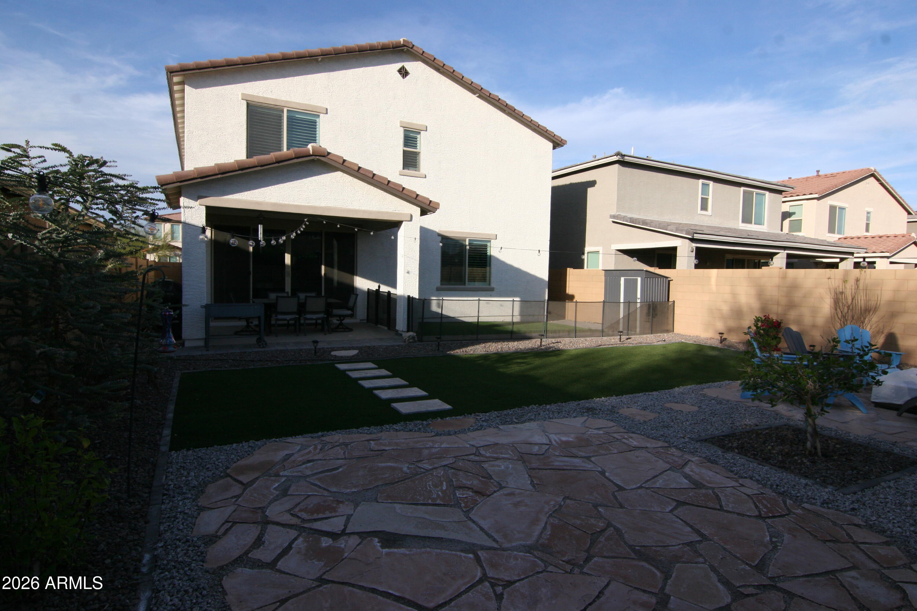 18487 West Ipswitch Way Surprise, AZ 85374 - Photo 25 of 36 a front view of a house with garden
