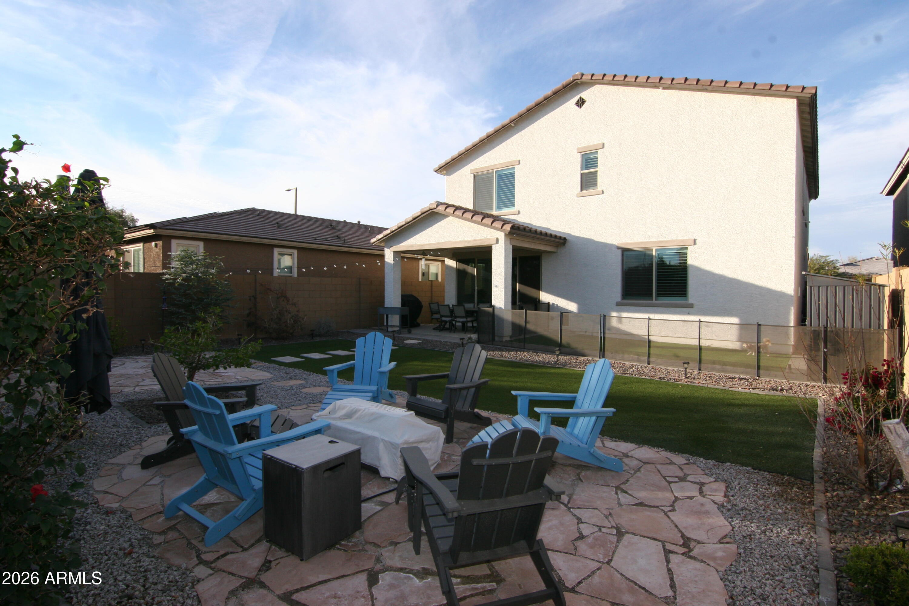 18487 West Ipswitch Way Surprise, AZ 85374 - Photo 26 of 36 a view of a house with backyard sitting area and garden