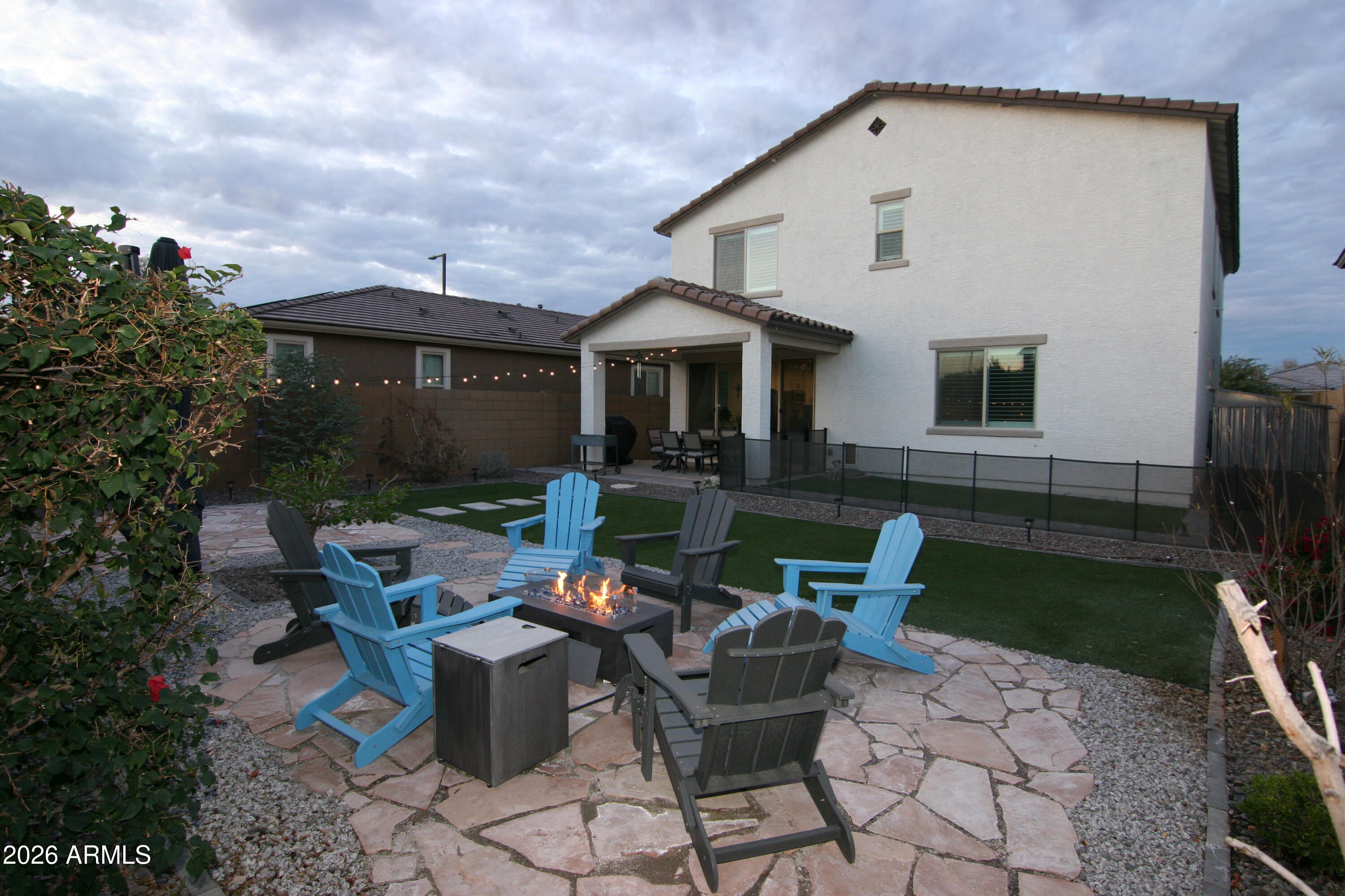18487 West Ipswitch Way Surprise, AZ 85374 - Photo 28 of 36 a view of a house with backyard sitting area and garden