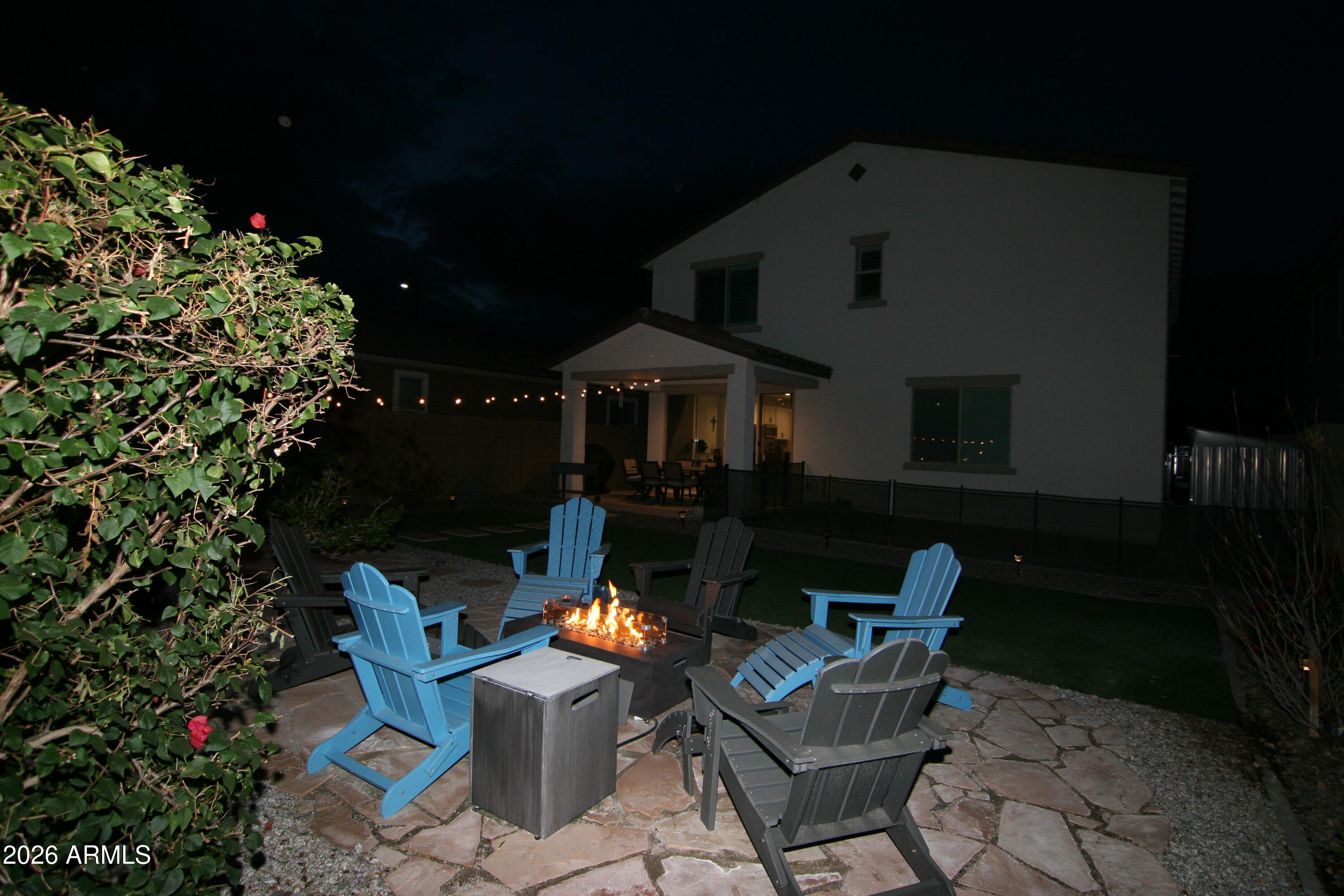 18487 West Ipswitch Way Surprise, AZ 85374 - Photo 32 of 36 a patio with table and chairs and potted plants