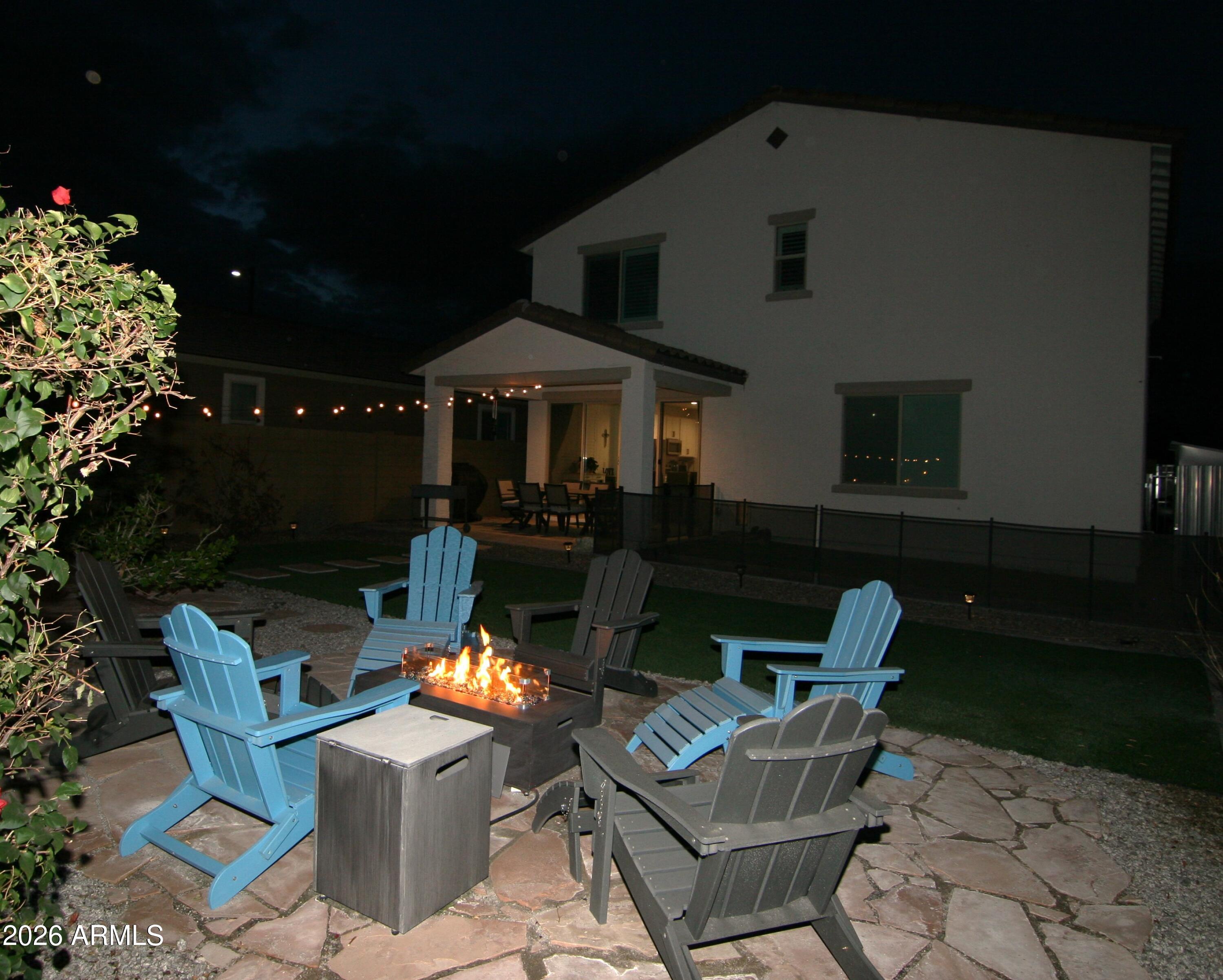 18487 West Ipswitch Way Surprise, AZ 85374 - Photo 33 of 36 a view of a patio with table and chairs and potted plants