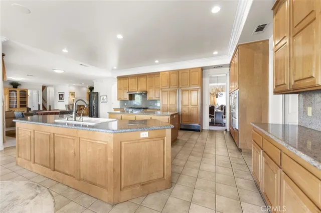 a spacious bedroom with a bed and a window