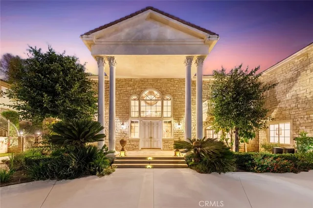 a view of swimming pool with outdoor seating and city view