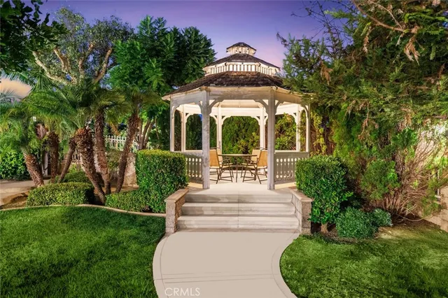 a view of a garden with a house