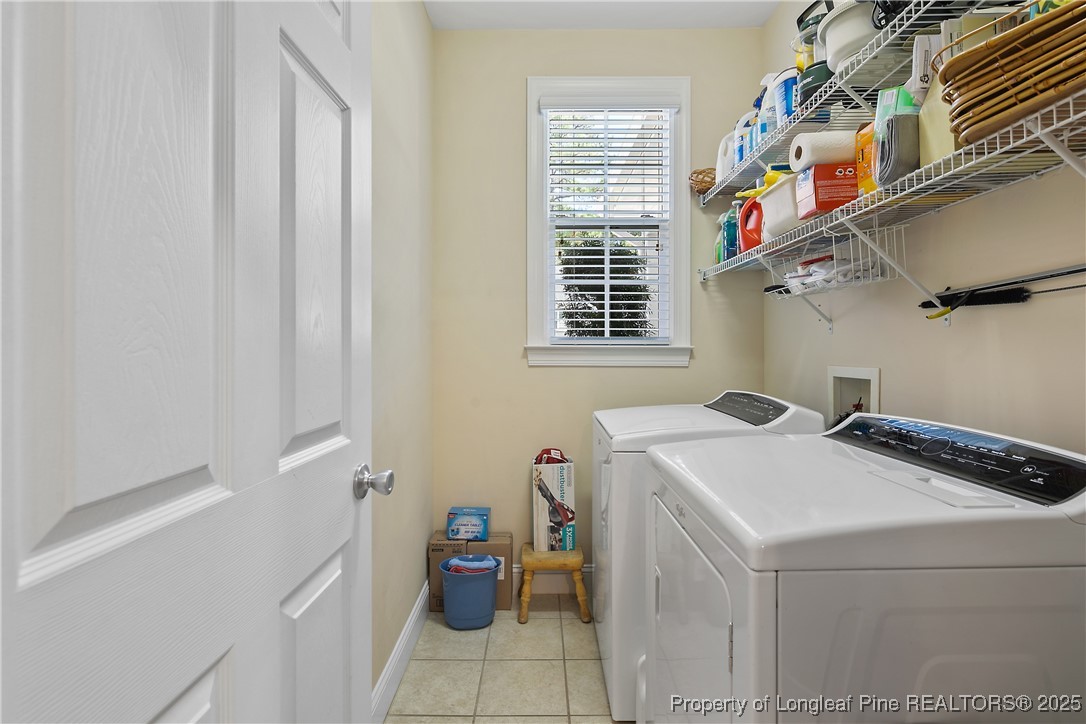 383 Falling Water Road Spring Lake, NC 28390 - Photo 17 of 33 a utility room with dryer and washer
