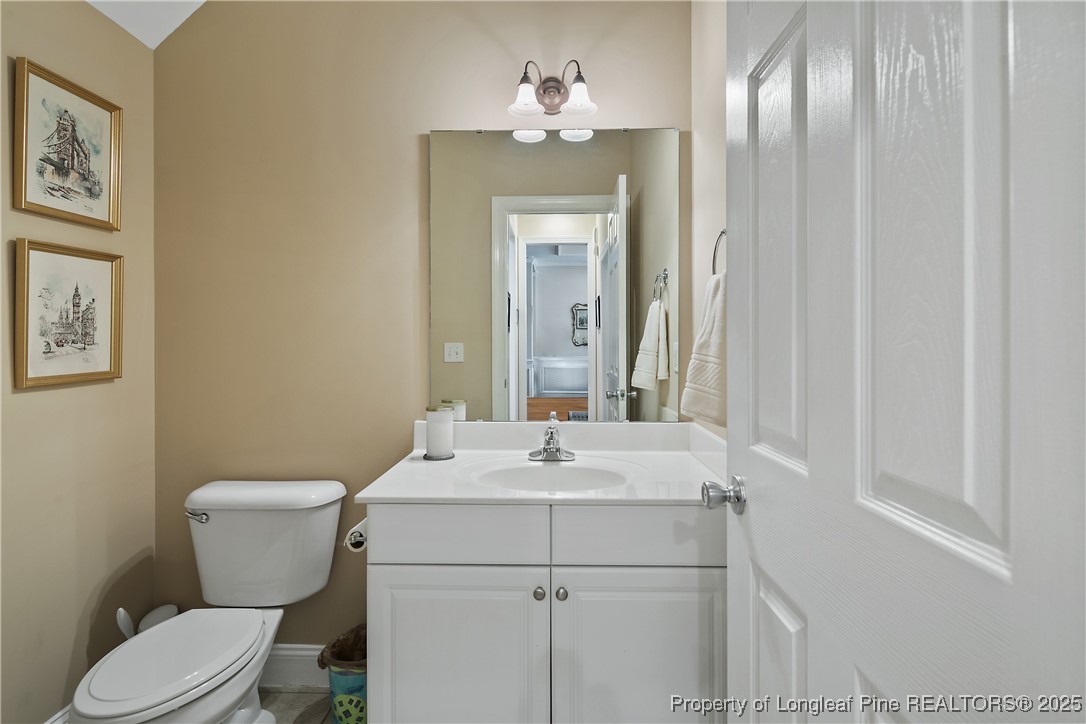 383 Falling Water Road Spring Lake, NC 28390 - Photo 18 of 33 a bathroom with a sink and a mirror