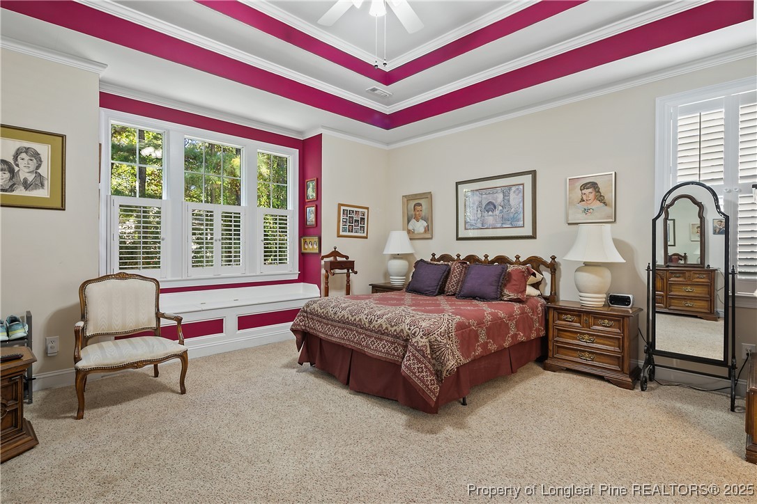 383 Falling Water Road Spring Lake, NC 28390 - Photo 19 of 33 a spacious bedroom with a bed and a couch