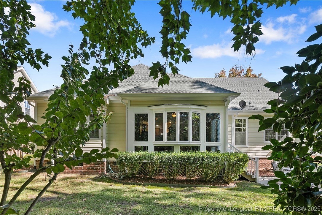 383 Falling Water Road Spring Lake, NC 28390 - Photo 2 of 33 a front view of a house with a garden