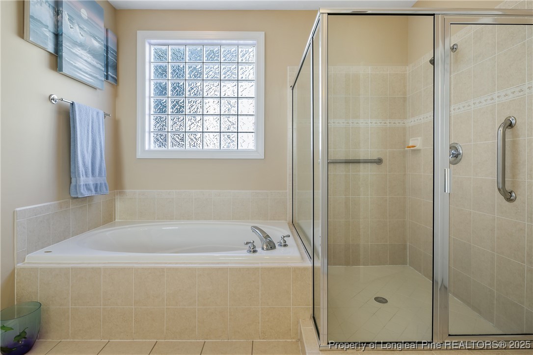 383 Falling Water Road Spring Lake, NC 28390 - Photo 24 of 33 a bathroom with a bathtub and shower