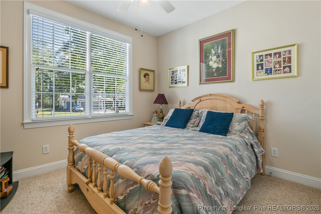 383 Falling Water Road Spring Lake, NC 28390 - Photo 26 of 33 a bedroom with a bed and a window