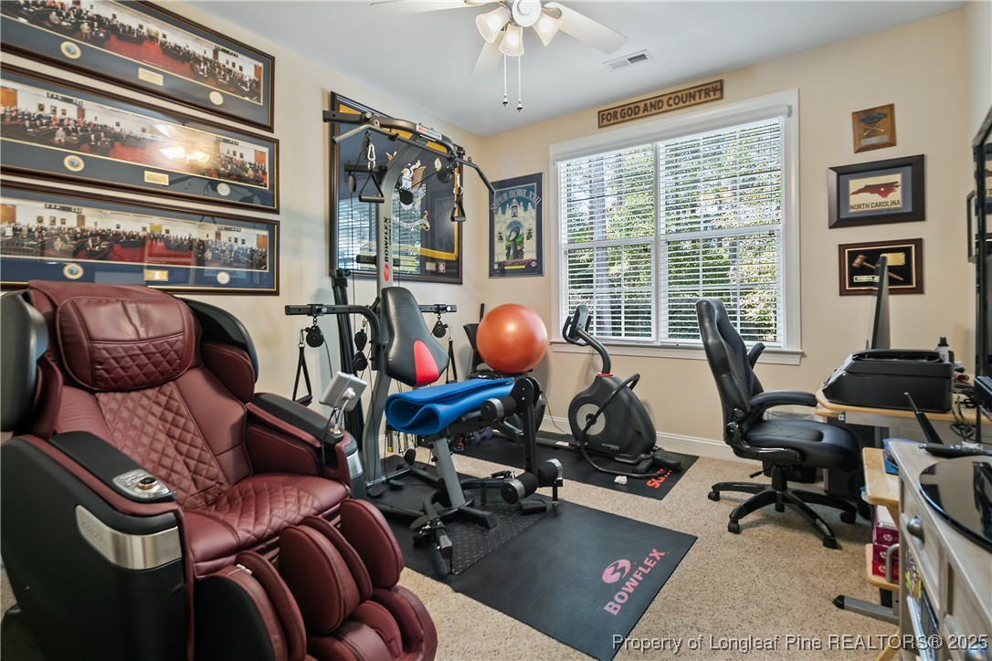 383 Falling Water Road Spring Lake, NC 28390 - Photo 29 of 33 a view of a livingroom with workspace and a window