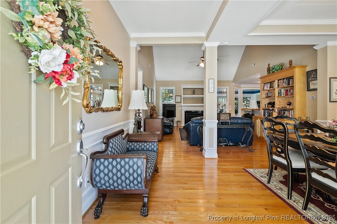 383 Falling Water Road Spring Lake, NC 28390 - Photo 4 of 33 a living room with fireplace furniture and a potted plant