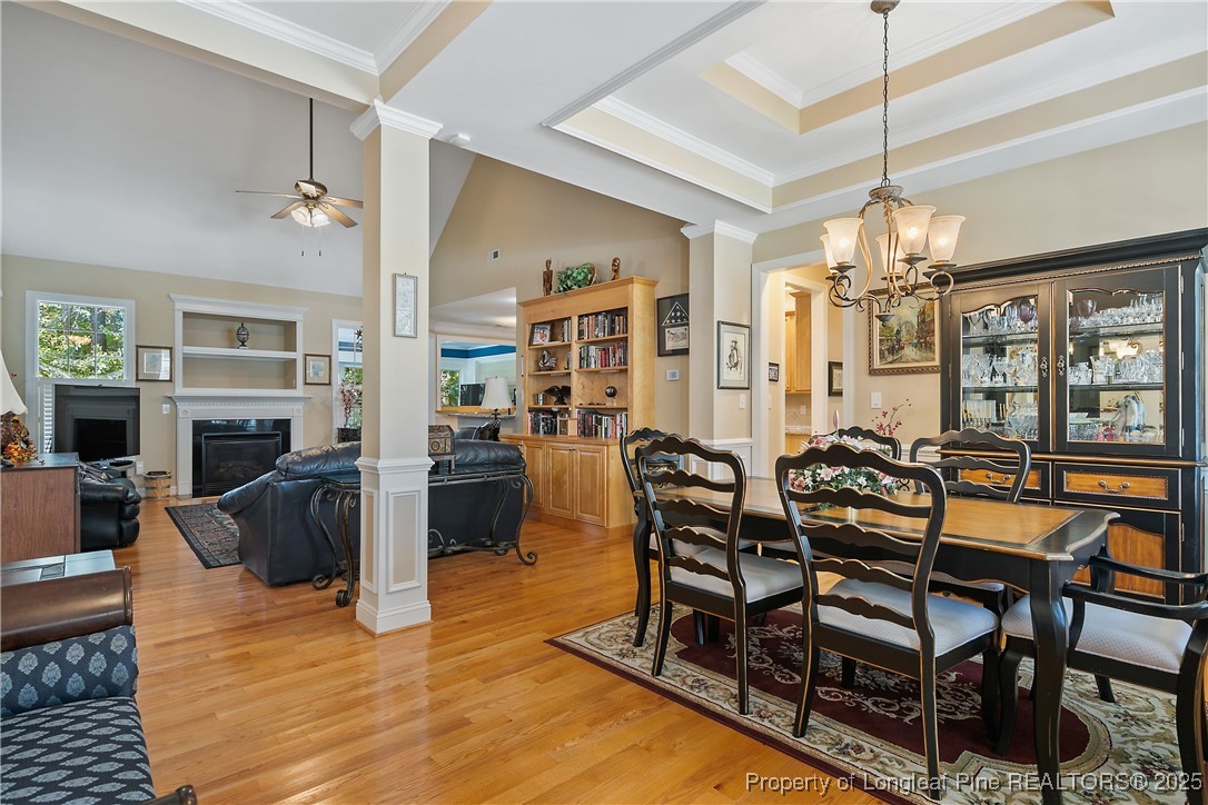 383 Falling Water Road Spring Lake, NC 28390 - Photo 5 of 33 a living room with fireplace furniture and a chandelier