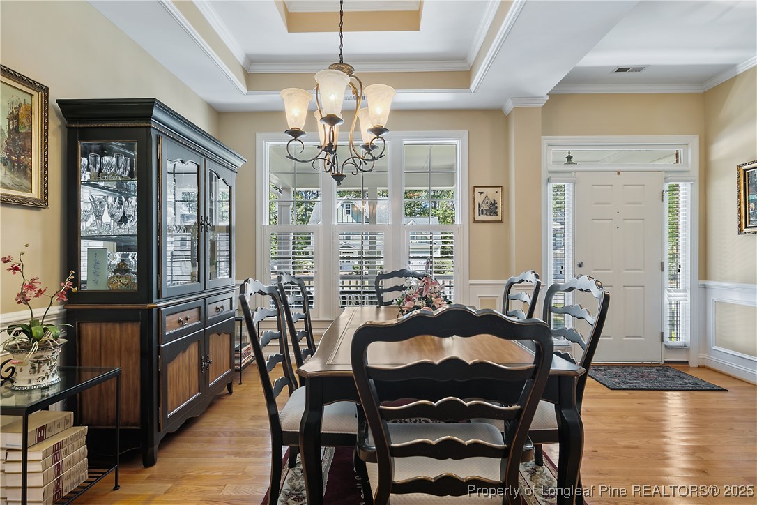 383 Falling Water Road Spring Lake, NC 28390 - Photo 6 of 33 a view of a dining room with furniture window and wooden floor