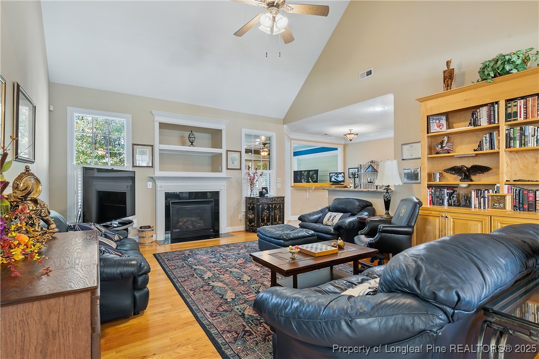 383 Falling Water Road Spring Lake, NC 28390 - Photo 7 of 33 a living room with furniture and a fireplace