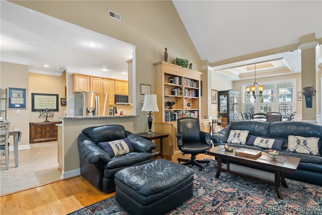 383 Falling Water Road Spring Lake, NC 28390 - Photo 8 of 33 a living room with furniture and a book shelf