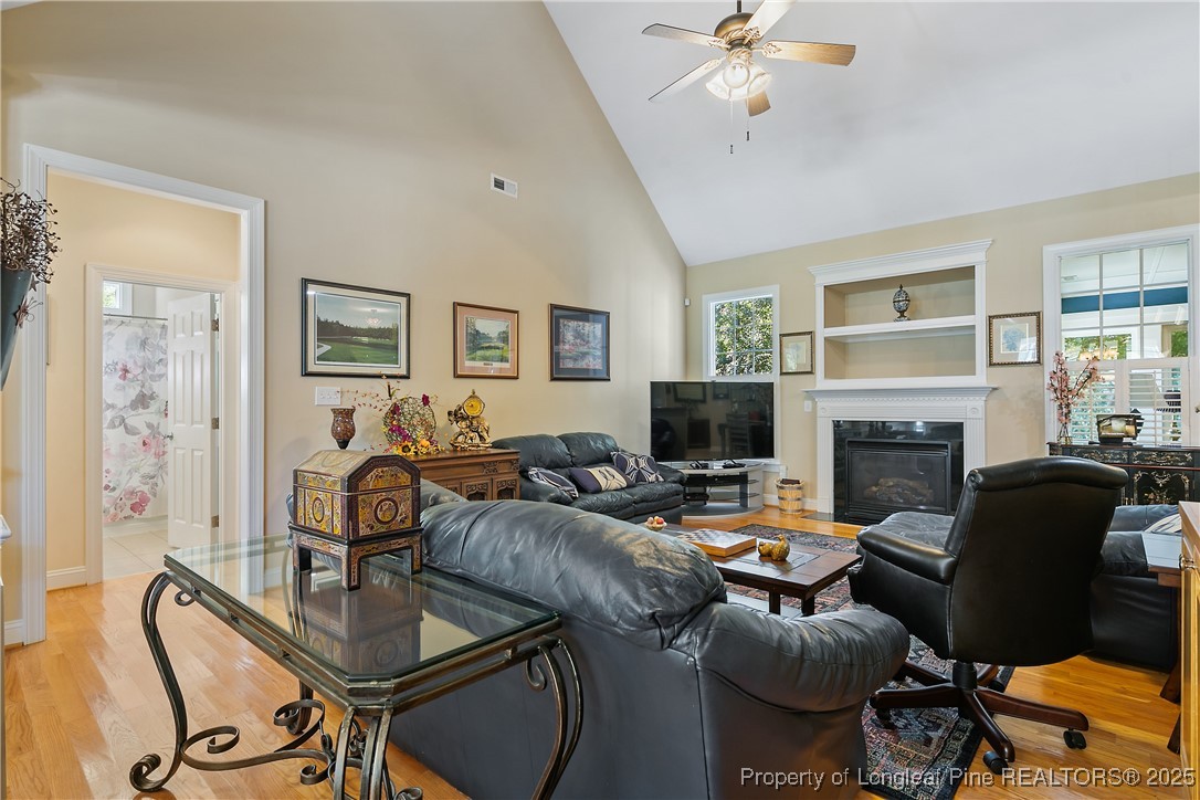 383 Falling Water Road Spring Lake, NC 28390 - Photo 10 of 33 a living room with furniture fireplace and a window