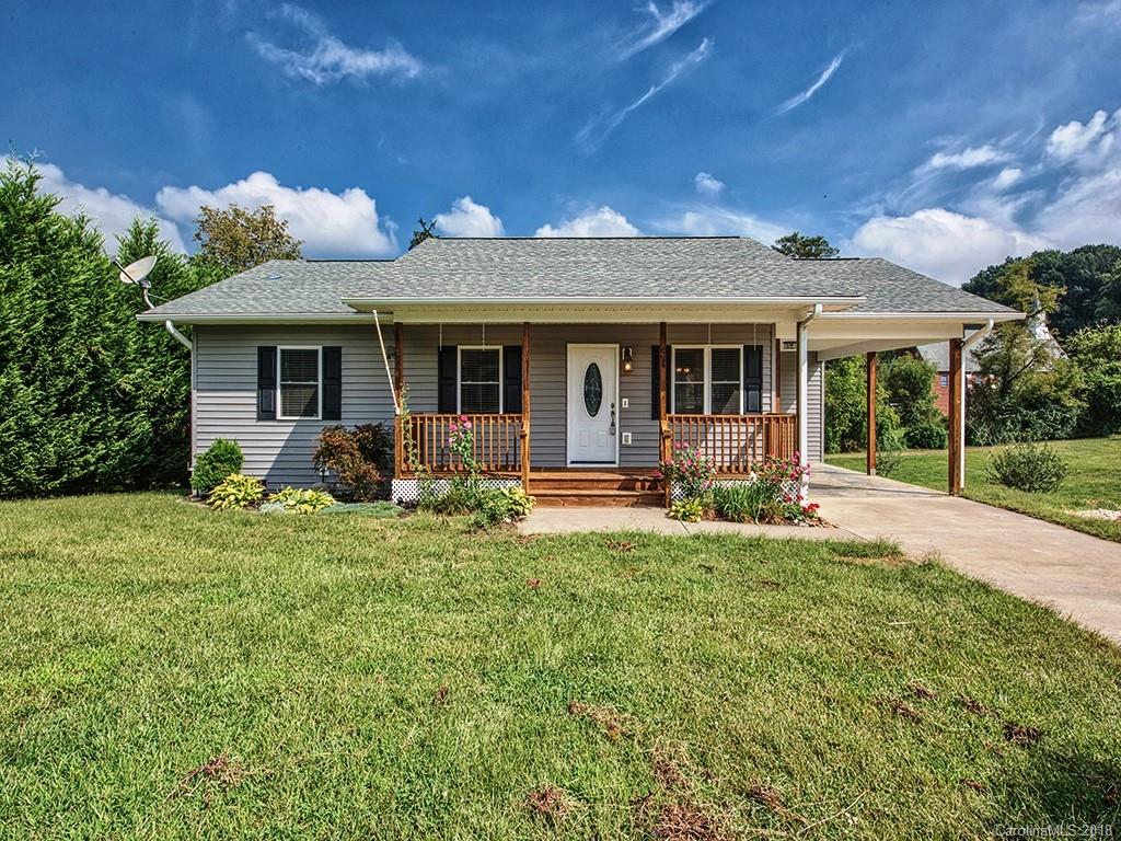 54 Barefoot Ridge Clyde, NC 28721 - Photo 1 of 24 a view of a house with backyard sitting area and porch
