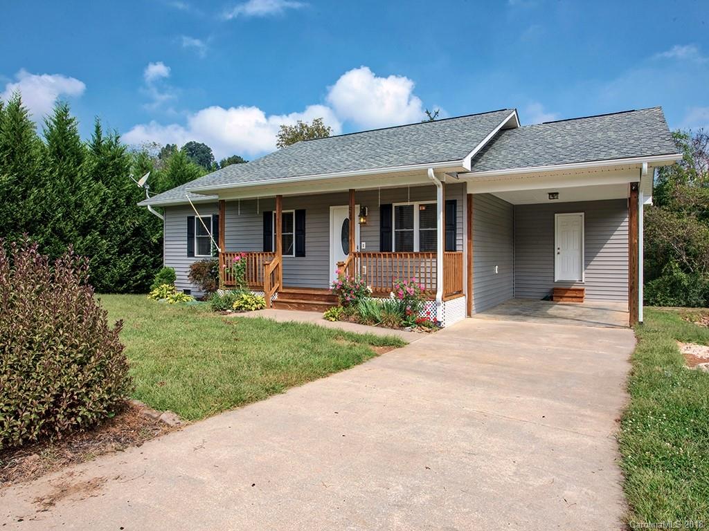 54 Barefoot Ridge Clyde, NC 28721 - Photo 2 of 24 a view of a house with yard and a garden