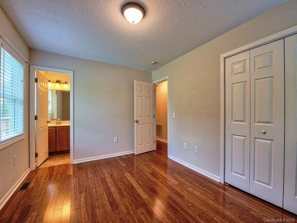 54 Barefoot Ridge Clyde, NC 28721 - Photo 16 of 24 an empty room with wooden floor and windows